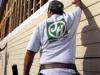 Construction worker wearing James Hardie logo top while building house Aug 2000.